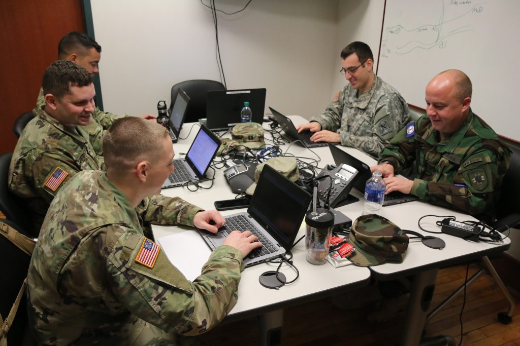 A team of cyber experts from the Virginia Army National Guard and Virginia Defense Force conduct another in a series of cyber assessments. (Photo by Cotton Puryear, Virginia National Guard Public Affairs)